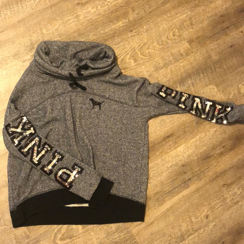 Pink long sleeve grey and black sweater